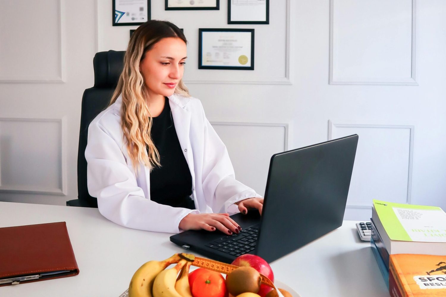 Photo of a Young Woman Working in a Doctors Office